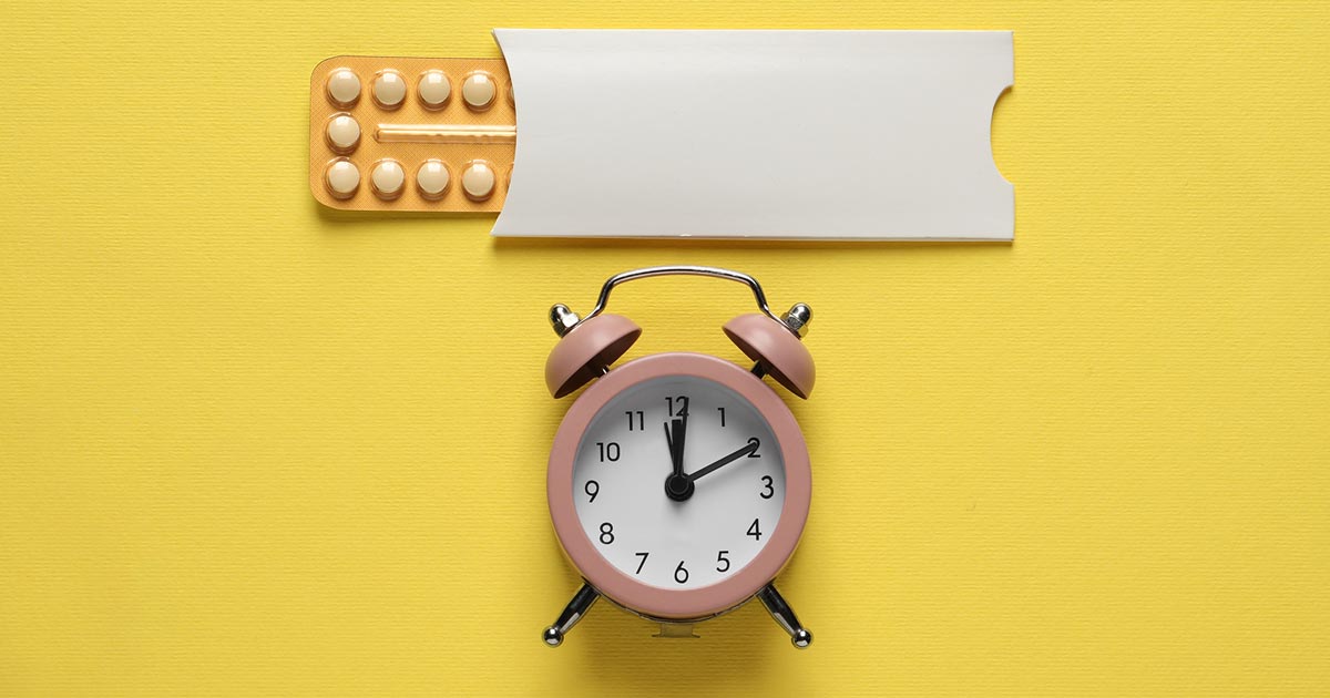 Image of contraceptive pills and a clock