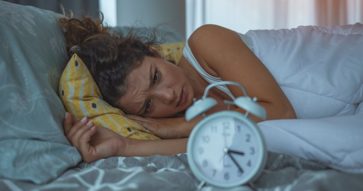Image d'une femme souffrant d'insomnie.