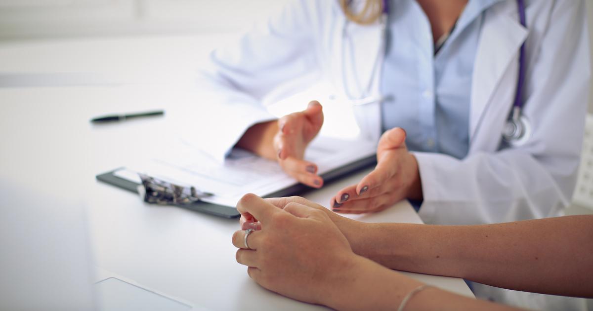 Male doctor having a consultation with a female patient