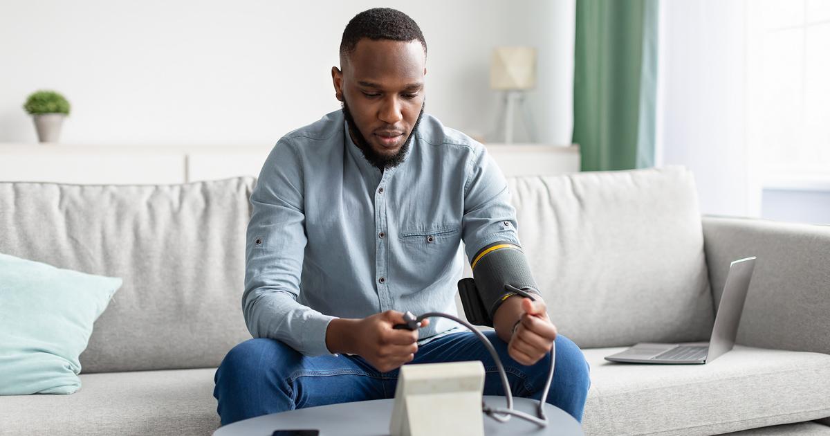 A man taking his blood pressure reading