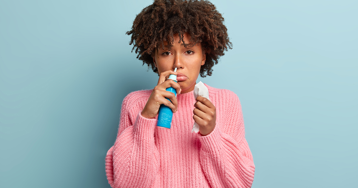 Woman looks sad with cold.