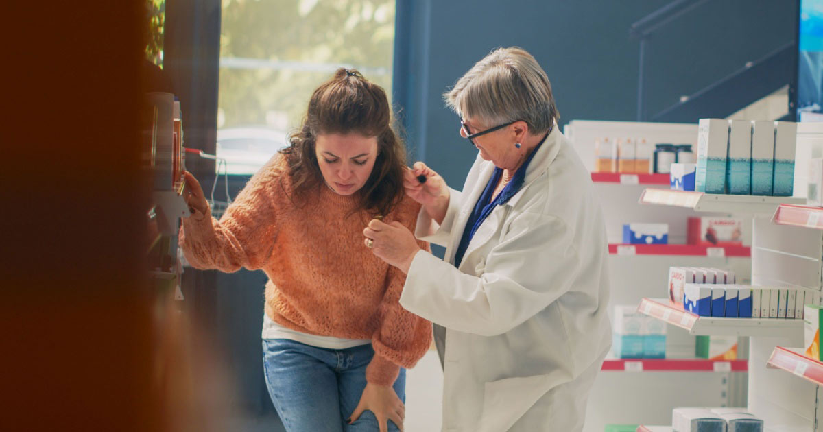 image of a young woman fainting in a pharmacy