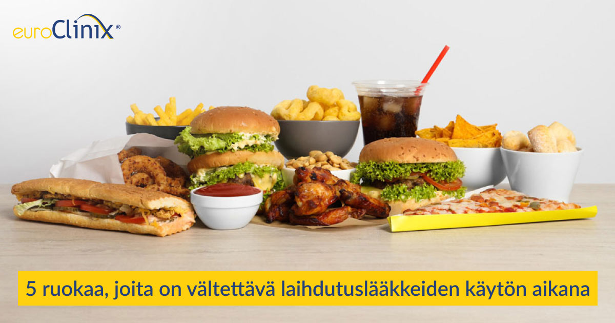 Valikoima epäterveellisiä ruokia harmaalla taustalla.